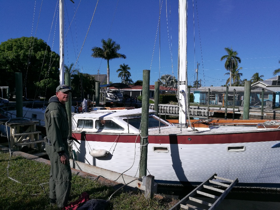 diver cleaning sailboat yacht bottom